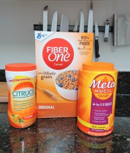 Photo of packaging of MetaMucil and Citrucel, dietary supplements and Fiber One cereal.