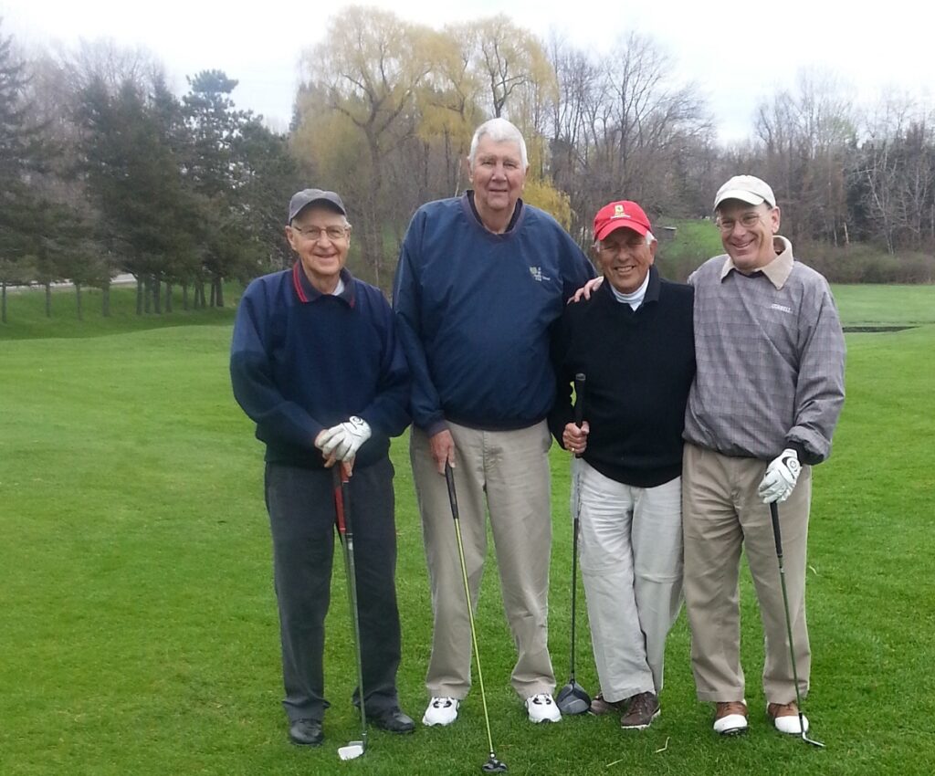 A foursome of old white guys after a round of golf